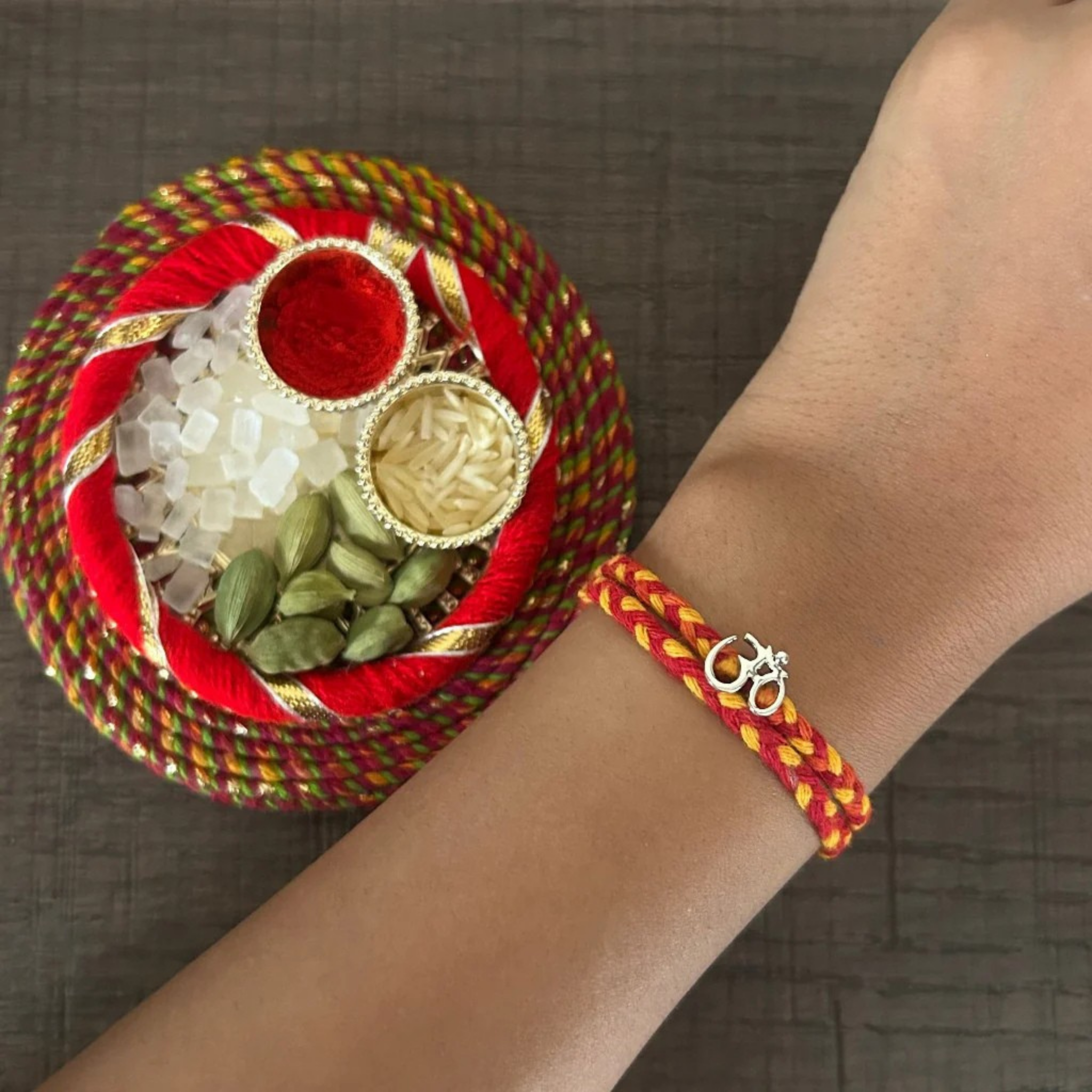 Om Silver Rakhi for Brother - Silver Rakhi with Roli Chawal and Greeting Card For Brother